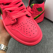 Close-up of the perforated toe box, laces and black-and-green side branding.