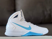 Side profile of a white Nike Hyperdunk basketball sneaker with a Carolina blue Swoosh and blue midsole section.