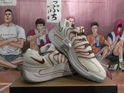 Angled view of the pair showing the mesh panels, layered side detailing, and gray outsole