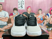 Front view of black and white Jordan Luka 1 shoes showing patterned laces and Jumpman tongue logos.