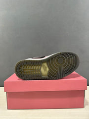 Underside view showing the circular traction pattern and textured rubber outsole.