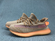 Pair of brown and beige low-top sneakers shown from an angled side view.