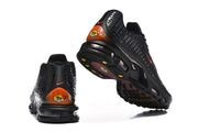 Heel and outsole views of black Nike Air Max Plus VII sneakers with orange heel details
