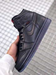 Angled side view highlighting the black upper, layered panels, wing branding, and translucent outsole.