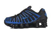 Side view of a black and blue Nike Shox sneaker