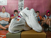 White sneakers shown from the side and at an angle