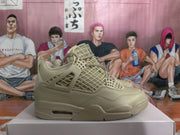 Side profile of a warm yellow Jordan sneaker showing the mesh upper, molded side support, stitched overlays, and visible heel air window.