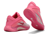 Pink Nike A'ja Wilson 1 shoes shown from the rear and outsole angles.