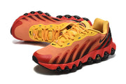 Nike Air Max DN8 sneakers in a side and angled view, highlighting the layered orange panels and sculpted sole.