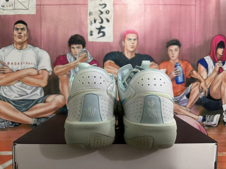 Rear view of the light-colored Nike Sabrina 2 basketball shoes showing perforated heels and sculpted soles
