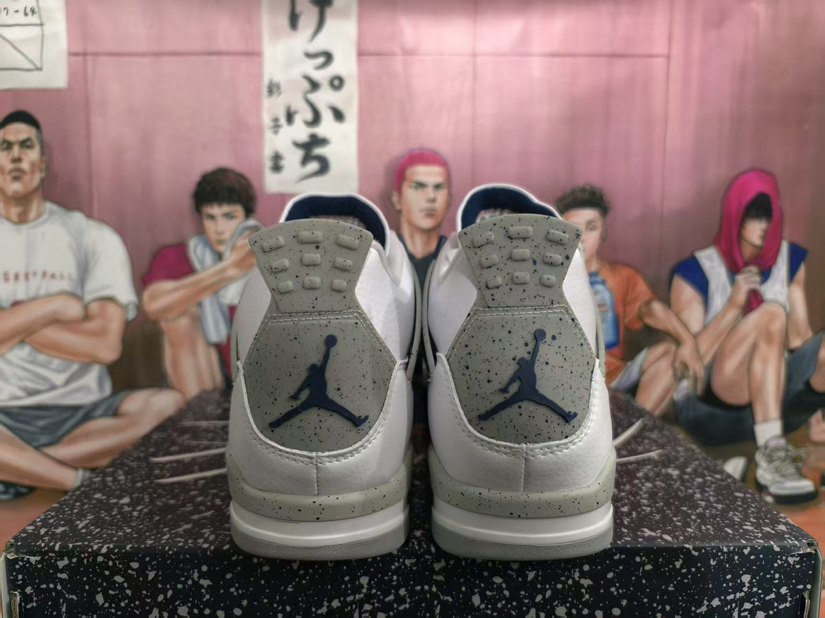 Rear view of white high-top sneakers showing speckled grey heel panels, dark blue Jumpman logos and layered soles.