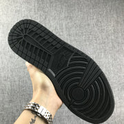 View of the black rubber outsole showing its circular traction pattern and segmented tread.