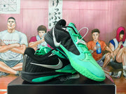Pair of black and bright green Nike basketball shoes shown from angled side and top views