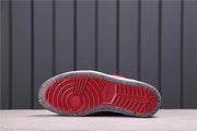 Underside view showing the red outsole center with a dark textured perimeter.