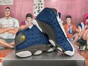 Pair of navy, charcoal, and white Jordan basketball sneakers shown from the side