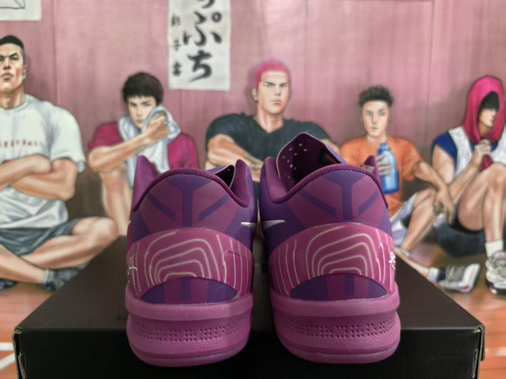 Rear view of purple Nike Kobe basketball shoes with patterned heel panels