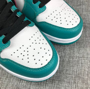 Close-up of perforated white toe panels bordered by teal overlays.