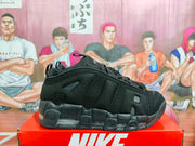 Side view of a black Nike basketball sneaker showing layered panels and segmented sole