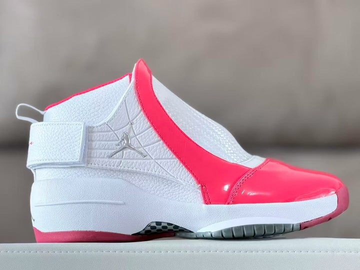 Side view of a white and bright red Jordan 19 high-top sneaker.