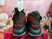 Rear view showing the LeBron heel logo, geometric heel panel, and pale outsole.