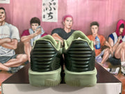 Rear view of the olive green Nike shoes with sculpted heel panels