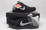 Nike Kobe 11 shoes displayed on a black shoebox