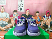 Front view of purple Nike basketball shoes with light gray laces and textured uppers.