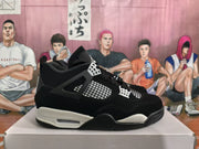 Side profile of a black and white high-top sneaker showing mesh inserts, paneled construction, and a visible heel cushioning window.