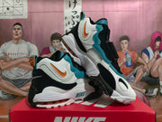 Angled view of the Nike sneakers showing layered panels and sculpted soles