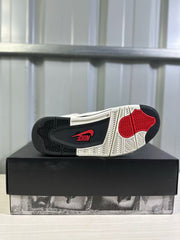 Bottom view of the sneaker showing a black, white, and red rubber outsole pattern.