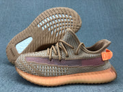 Angled view of the sneaker with the outsole lifted, showing Adidas branding and the translucent sole structure.