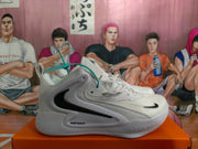 Side profile of a white Nike basketball sneaker with a large black Swoosh, “JUST DO IT” lettering and molded midsole details.