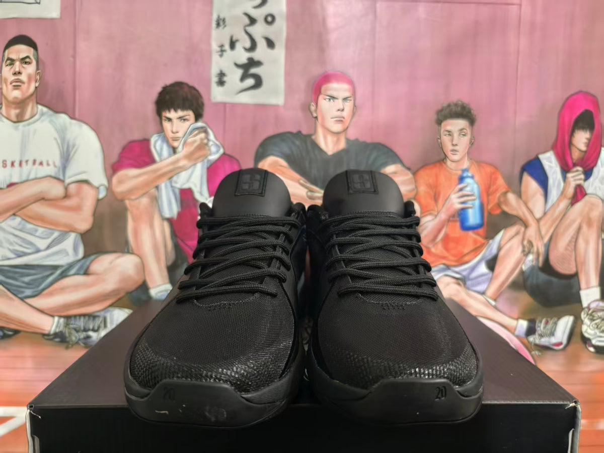 Front view of black Nike basketball shoes with lace-up fronts