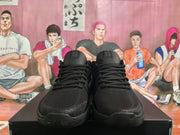 Front view of black Nike basketball shoes with lace-up fronts