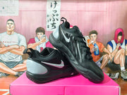 Angled view highlighting the black upper, side Swoosh, and gray heel panel.