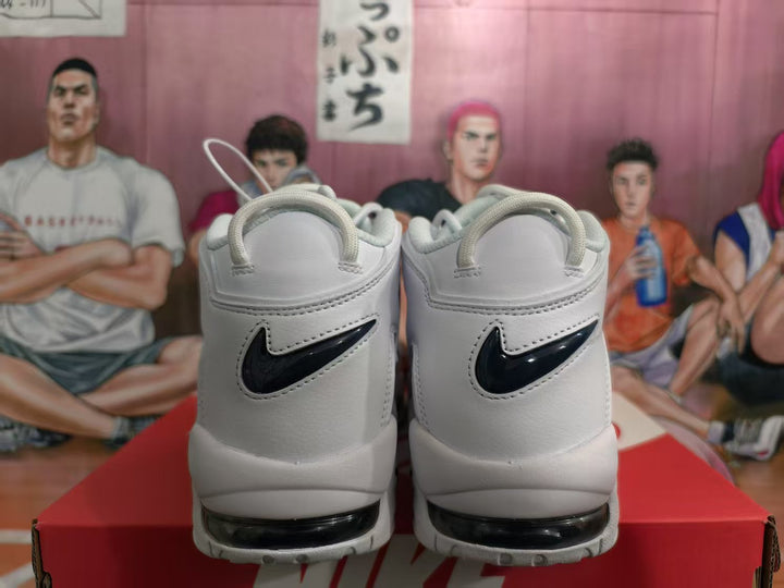 Rear view of white Nike sneakers with glossy dark blue Swoosh logos and visible sole air windows.