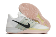 Side view of a white and green Nike Sabrina 3 shoe with its patterned outsole