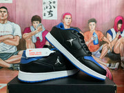 Angled side view highlighting the black upper, blue accents, white midsole, and blue outsole