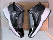 Pair of sneakers showing the side panels, ankle straps, and white midsoles