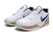 Pair of white Nike Ja 2 basketball shoes with blue side accents and tan speckled soles