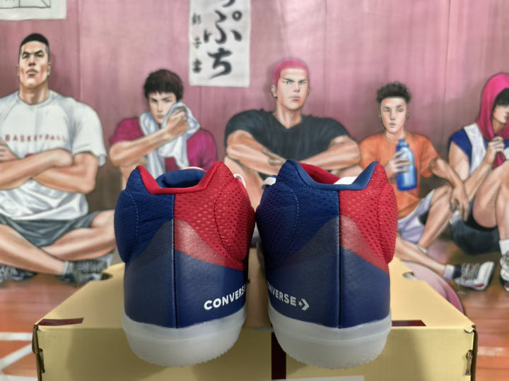Rear view of red and blue Converse sneakers showing white heel branding and translucent-looking soles.