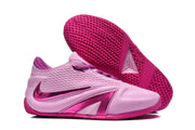 Pink basketball shoe with textured outsole shown beside the shoe exterior