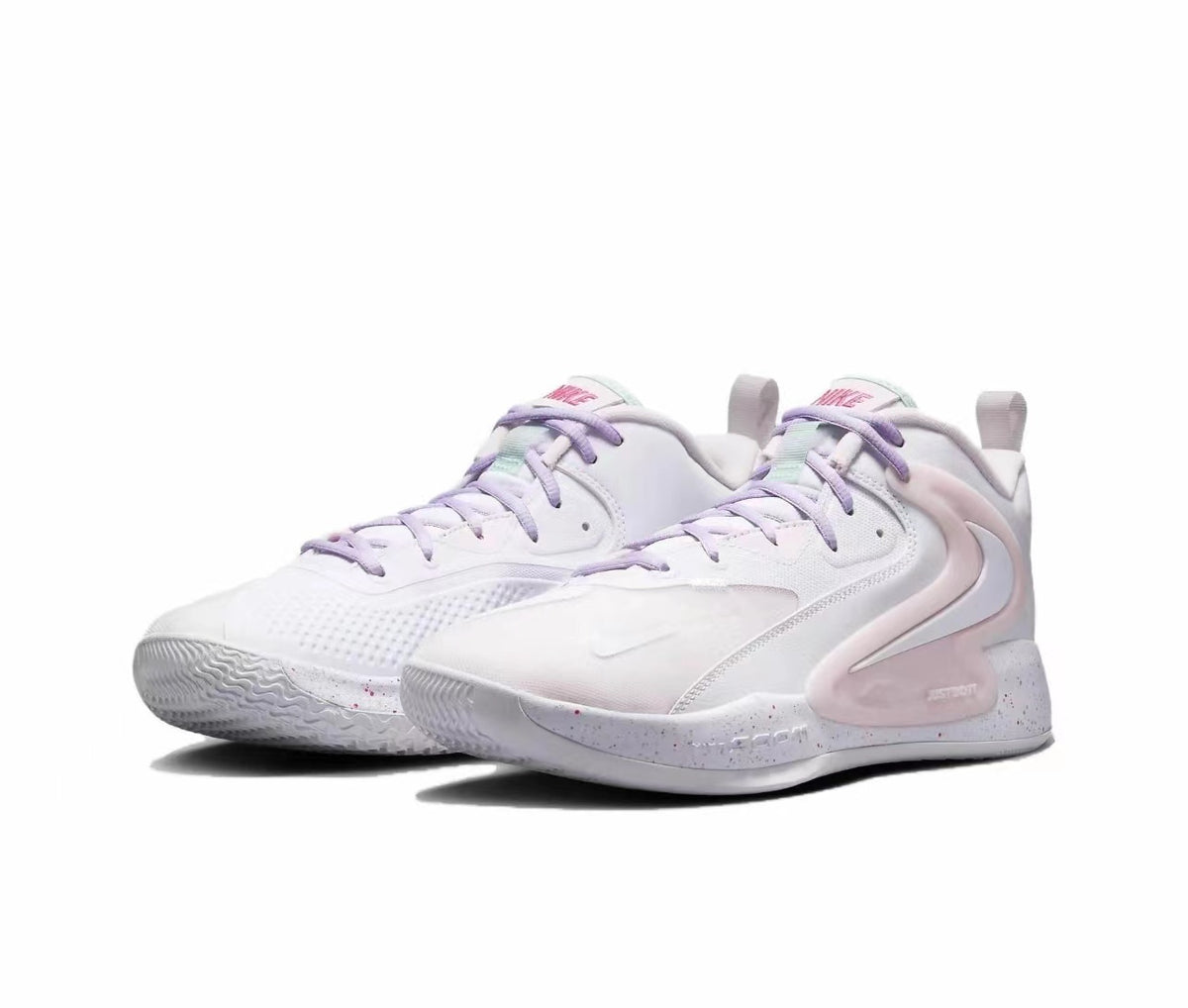 Pair of white Nike basketball sneakers with pink and lavender accents, layered side panels, textured toe areas, and speckled midsoles.