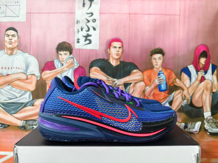 Blue and purple Nike GT basketball shoes with red side logos and purple laces, shown from the side.
