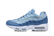 Side profile of a blue Nike Air Max 95 sneaker with a white midsole.