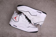 Pair of white and black sneakers shown from an angled overhead view