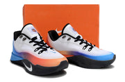 Pair of white Nike S.T. Flare EP shoes with blue and orange accents beside an orange box.