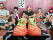 Front view of the pair showing the peach and coral textured toe boxes with mint-green laces.