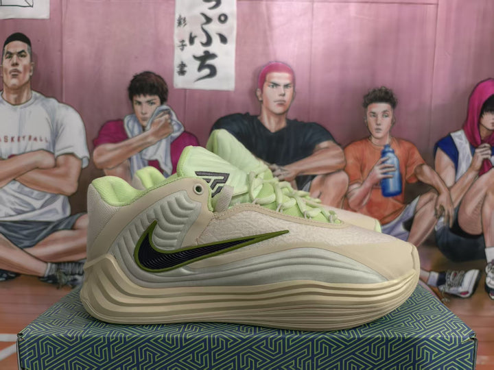 Side view of beige and lime Nike basketball sneakers showing the layered outsole and side swoosh.