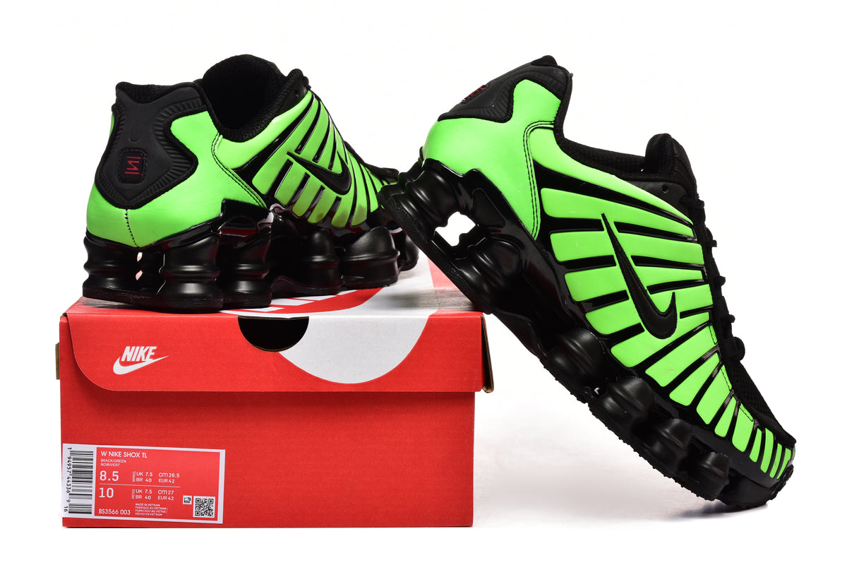 Green-and-black Nike Shox TL sneakers displayed with a shoe box.